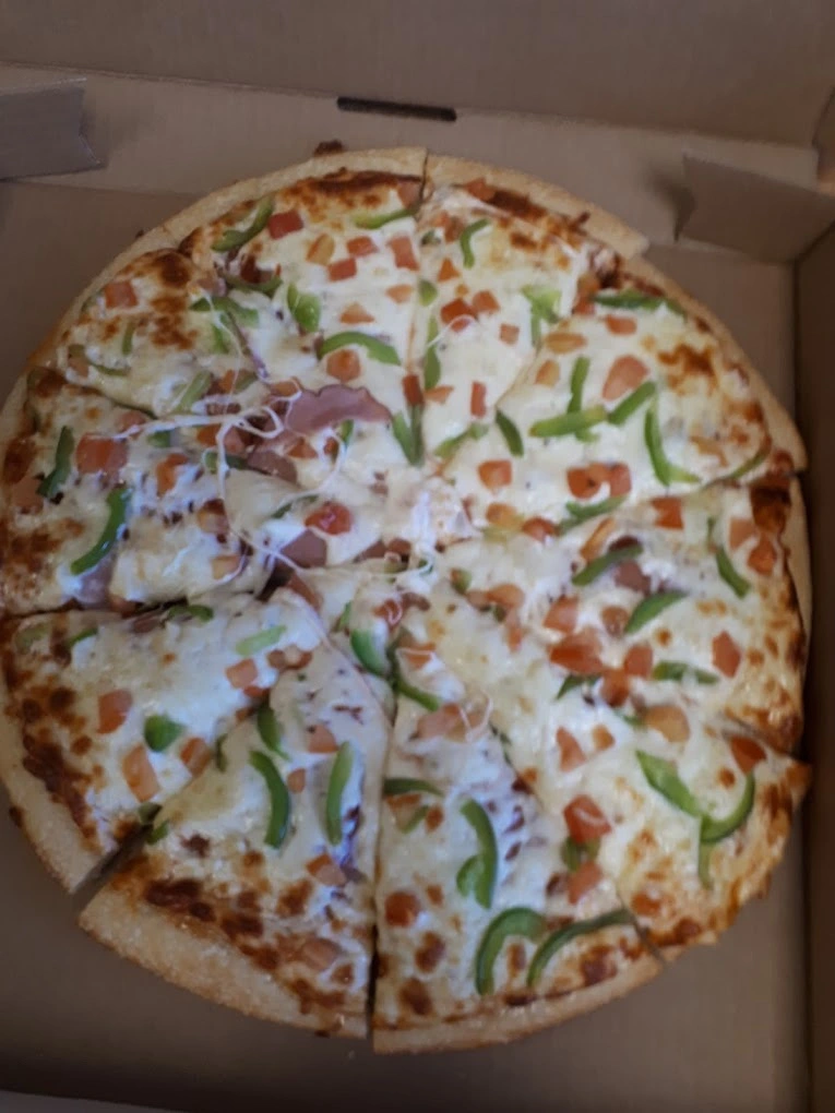 Fresh handcrafted pizza at YROC Pizza in Innisfail, AB